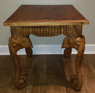Table with elephant head legs
